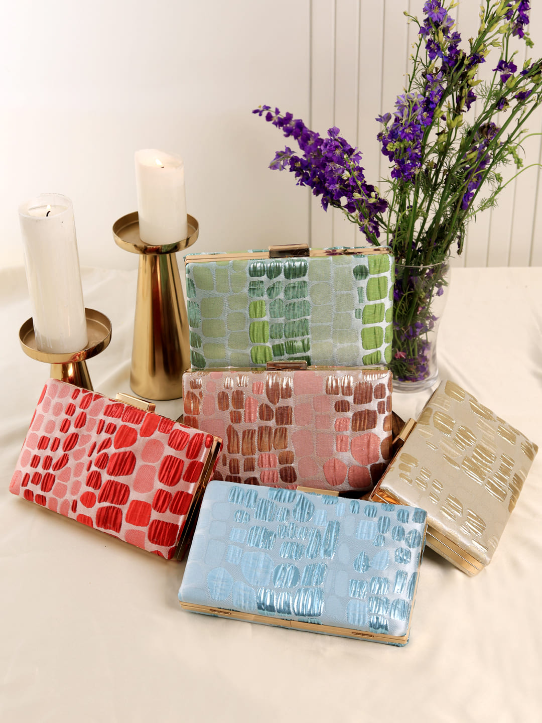 Set of 5 coral-colored wedding favors by THE TAN CLAN, sleek and elegant decorative keepsakes for special occasions.