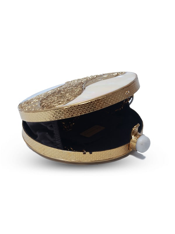 Crescent-shaped mother of pearl clutch by The Tan Clan with a shiny, iridescent surface and compact design for elegant occasions.