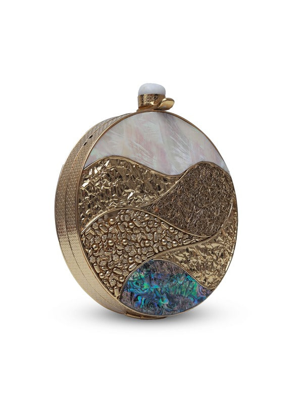 Crescent-shaped round clutch bag with mother of pearl exterior by The Tan Clan, featuring a sleek, elegant design.
