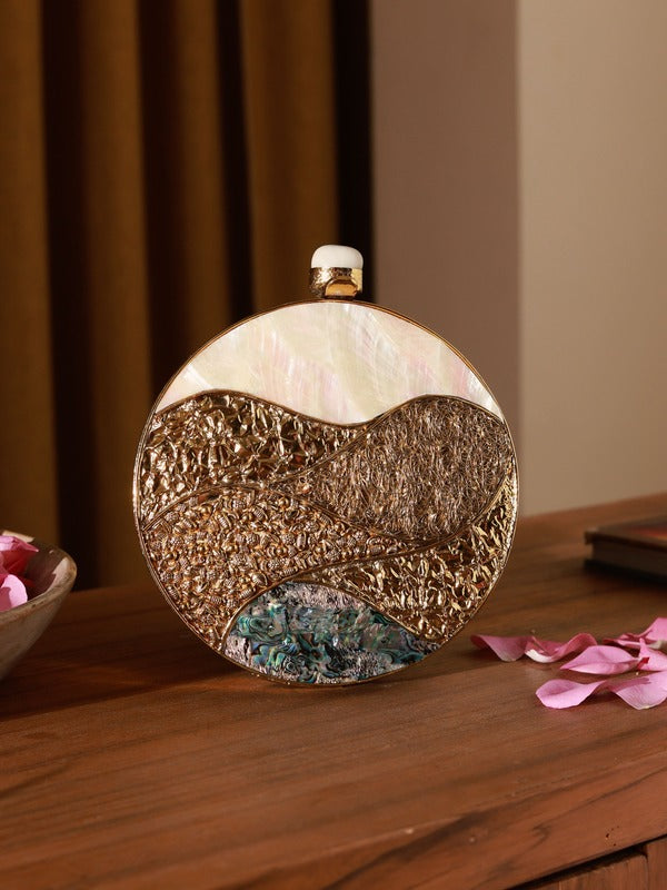 Crescent-shaped Mother of Pearl clutch bag by The Tan Clan with a shimmering iridescent finish and rounded design.