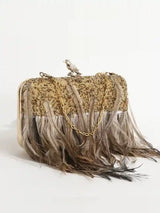 Dark gold embroidered feather clutch bag by The Tan Clan with intricate hand embroidery and feather details.
