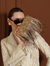 Dark gold embroidered feather clutch by The Tan Clan, featuring intricate hand embroidery and a sleek, elegant design.