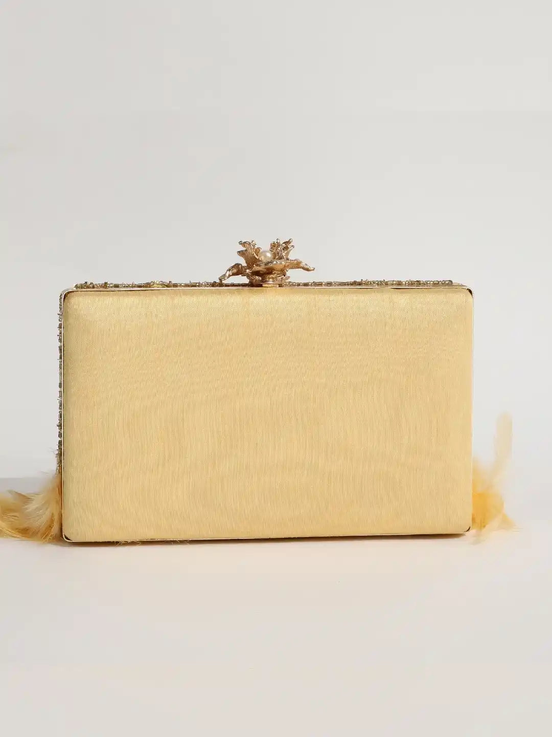 Light gold feather embroidered clutch by The Tan Clan featuring intricate hand embroidery and a sleek, elegant design.
