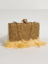 Light gold Daina hand-embroidered feather clutch by The Tan Clan, featuring intricate embroidery and elegant design.