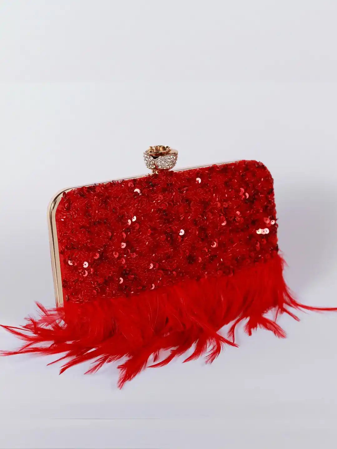 Red Daina hand-embroidered feather clutch by The Tan Clan, featuring intricate embroidery and a stylish compact design.