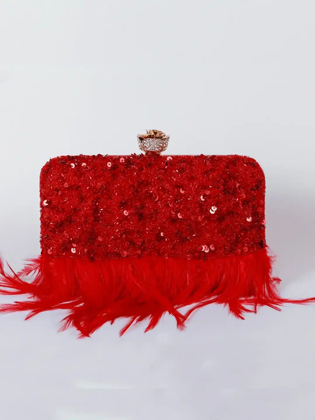 Red Daina hand-embroidered feather clutch by The Tan Clan with intricate embroidery and feather details, stylish and elegant accessory.