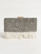 Daina white hand-embroidered feather clutch by The Tan Clan, featuring intricate embroidery and elegant feather detail.