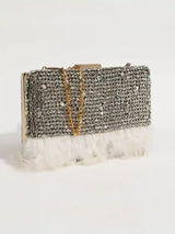 Daina white hand-embroidered feather clutch by The Tan Clan showing intricate embroidery and feather details on a stylish purse.