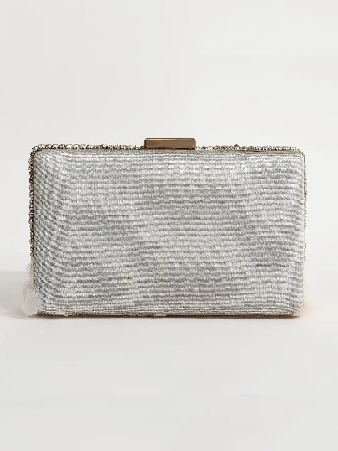 White hand-embroidered feather clutch bag with intricate detailing, designed by The Tan Clan for elegant style.