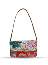 Daisy floral Baguette bag with handle by The Tan Clan, featuring colorful daisy pattern and compact design.