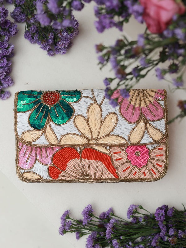 Daisy floral baguette bag with handle from The Tan Clan, featuring a colorful daisy print and compact design for stylish carrying.