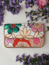Daisy floral baguette bag with handle from The Tan Clan, featuring a colorful daisy print and compact design for stylish carrying.