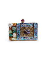 Disha Mother of Pearl Clutch by The Tan Clan featuring a shimmering pearl finish and elegant design for special occasions.