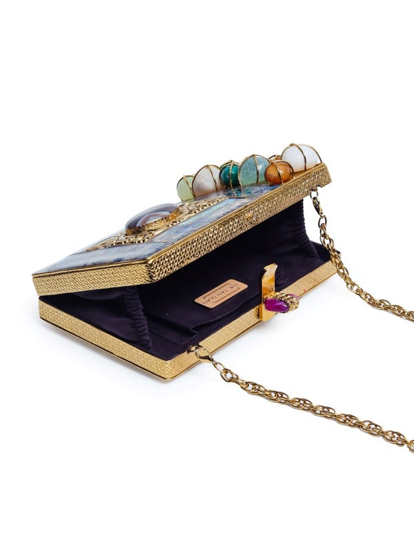 Disha Mother of Pearl Clutch by The Tan Clan featuring a shimmering pearl finish and compact design for elegant occasions