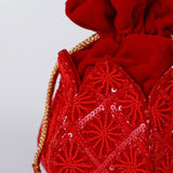 Hand-embroidered lotus design on The Tan Clan Ehsaas hand-embroidered potli bag with intricate detailing and traditional craftsmanship.