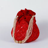 Hand-embroidered lotus motif on beige fabric, traditional Ehsaas hand-embroidered Lotus Potli bag by The Tan Clan displayed.