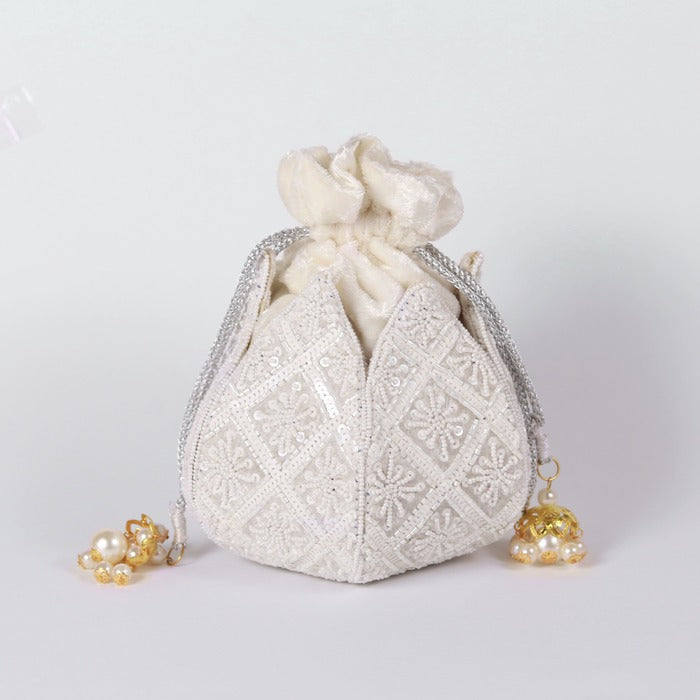 Hand-embroidered Lotus Potli bag by The Tan Clan featuring intricate embroidery and traditional design.