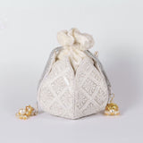 Hand-embroidered Lotus Potli bag by The Tan Clan featuring intricate embroidery and traditional design.