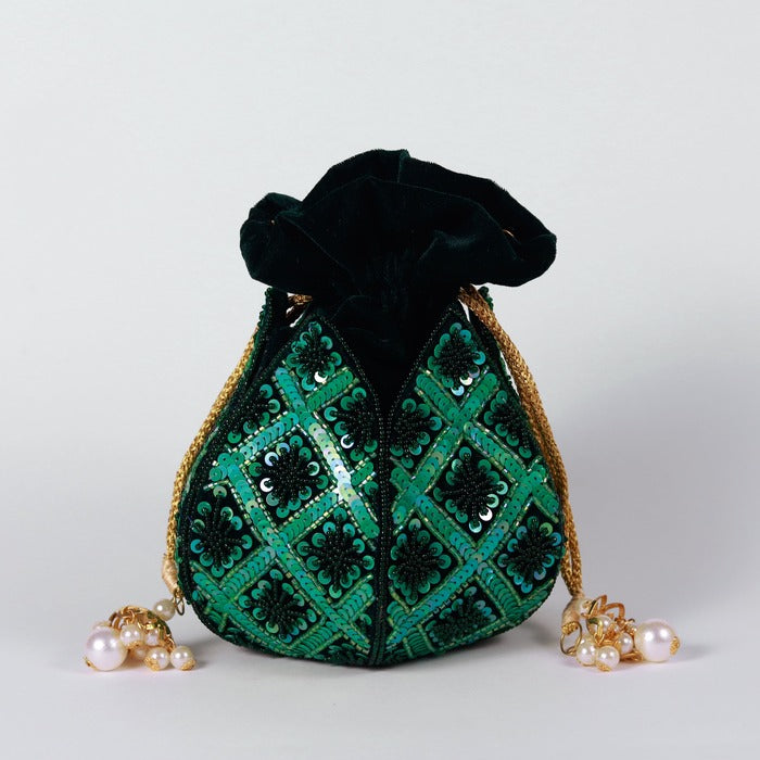 Hand embroidered lotus design on The Tan Clan Ehsaas hand-embroidered potli bag, showcasing intricate craftsmanship and traditional style.