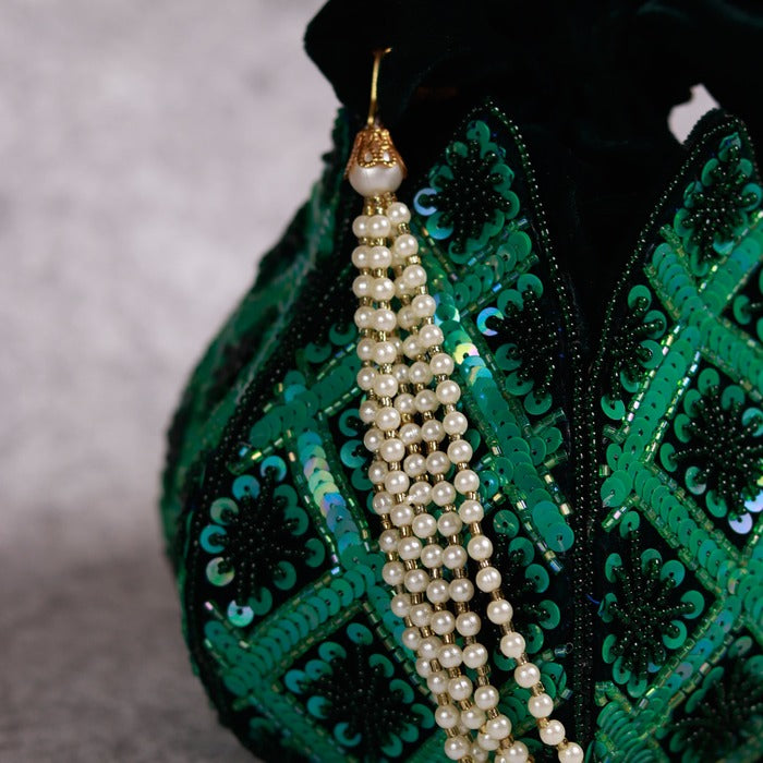 Hand-embroidered Lotus Potli bag by The Tan Clan featuring intricate floral embroidery and traditional Indian craftsmanship.