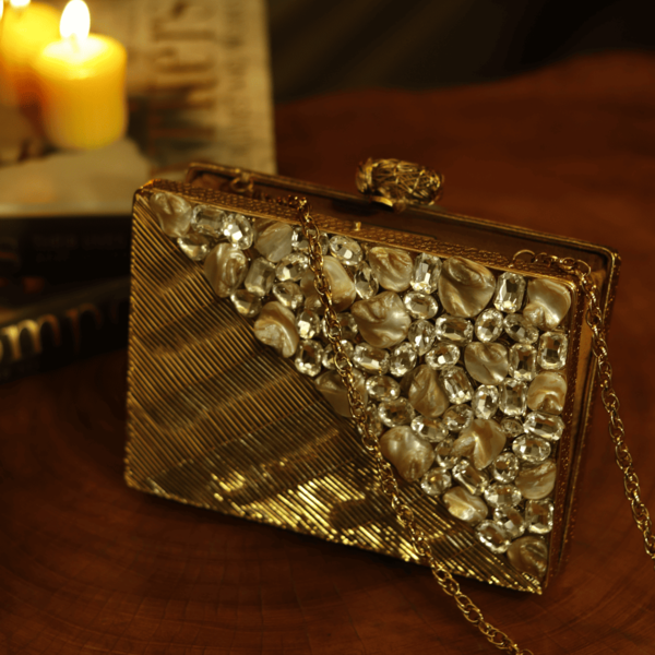 Eira Golden Embellished Brass Clutch with intricate details and elegant design, crafted by The Tan Clan.