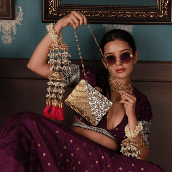Eira Golden Embellished Brass Clutch with intricate design and metallic finish by The Tan Clan.