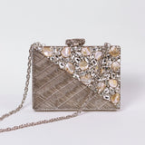 Silver embellished brass clutch bag with intricate details from The Tan Clan Eira collection, stylish for evening wear.
