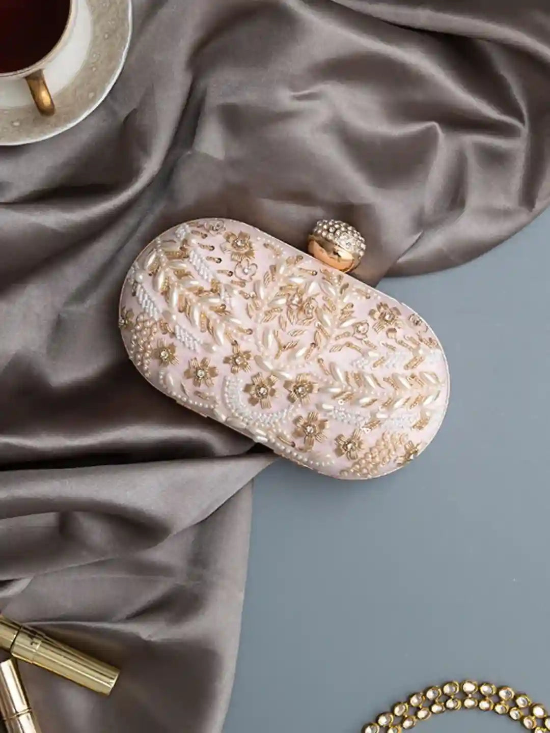 Pink Zardozi embroidered clutch bag for babies from The Tan Clan, featuring intricate hand embroidery and elegant design.