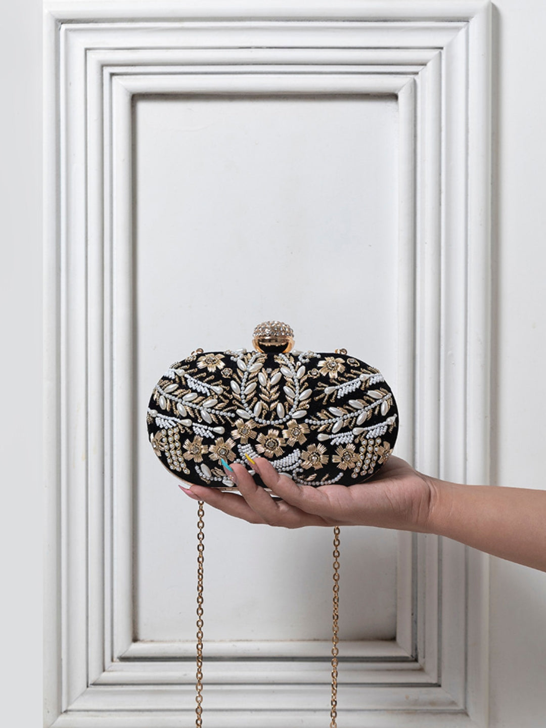 Black Zardozi embroidered clutch bag with intricate hand embroidery by The Tan Clan, featuring elegant traditional design.