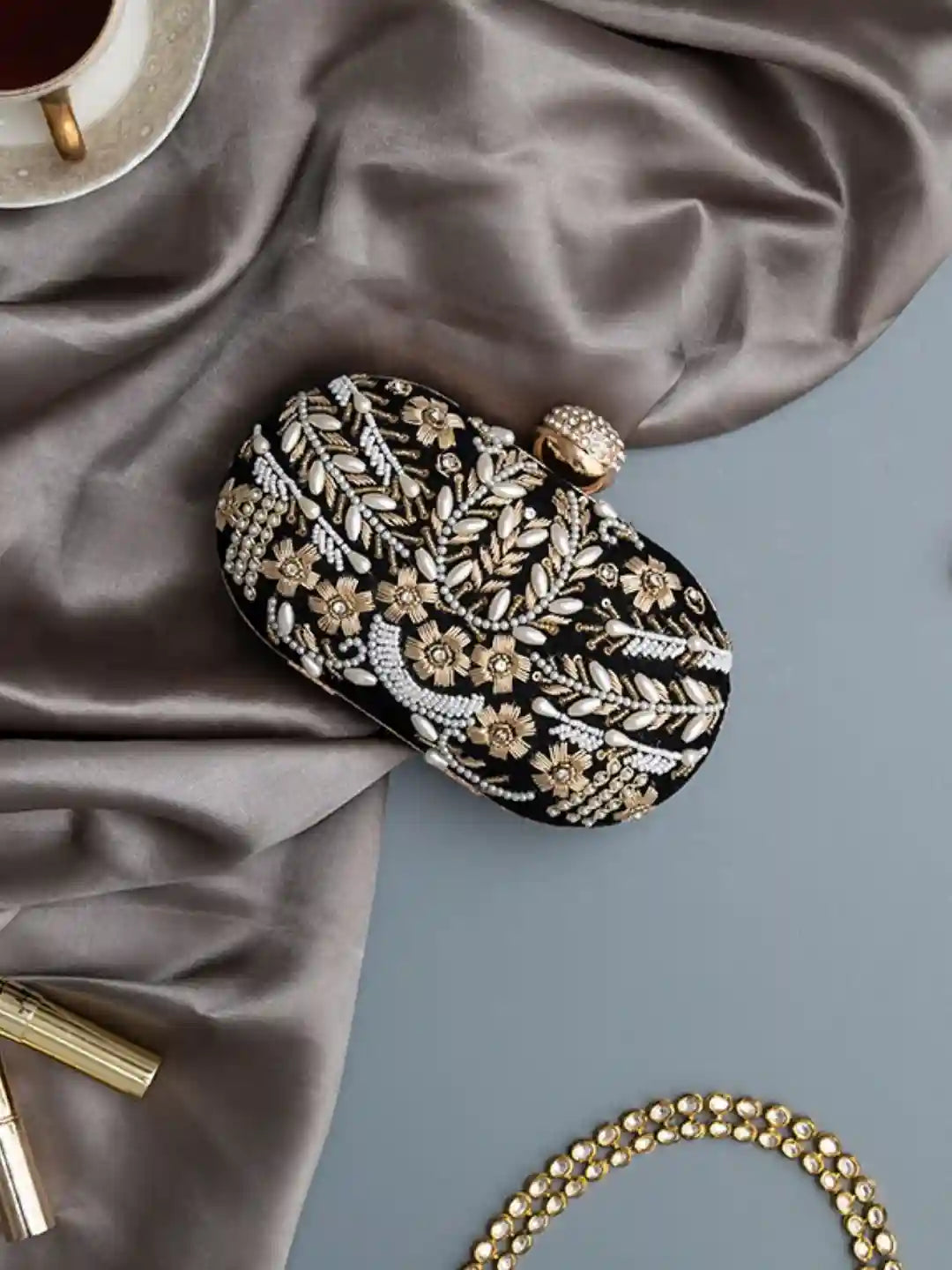 Black Zardozi embroidered clutch bag with intricate hand embroidery from The Tan Clan, featuring traditional Indian craftsmanship.