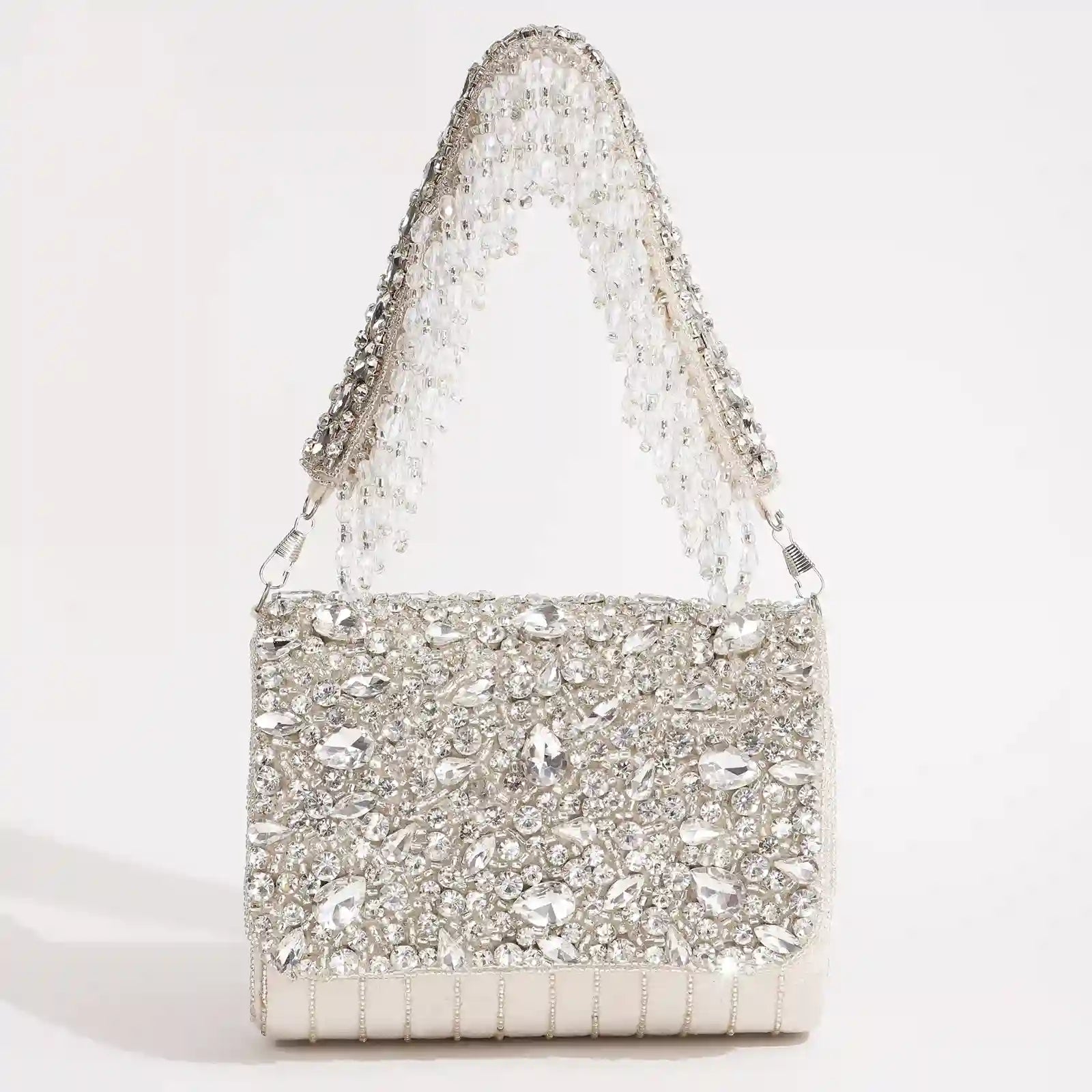 White Grace Embellished Flap Over Bag by The Tan Clan with decorative accents and a structured design, featuring a flap closure.