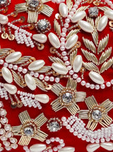 Red Zardozi embroidered clutch bag with intricate hand embroidery, featuring elegant traditional design by The Tan Clan.