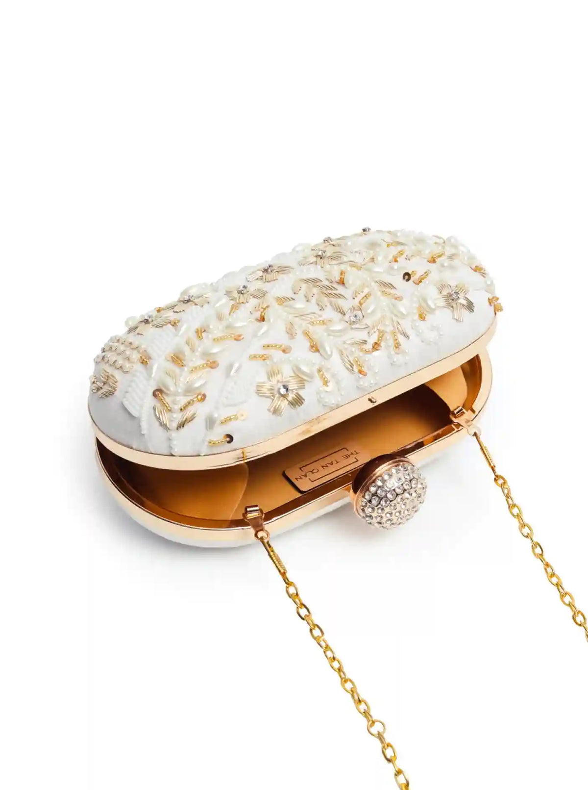 Elizah Zardozi hand-embroidered clutch by The Tan Clan featuring intricate metallic thread embroidery on a stylish evening bag.