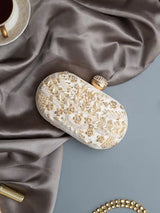 Elizah Zardozi hand-embroidered clutch by The Tan Clan featuring intricate gold and colorful thread embroidery on a sleek fabric background.