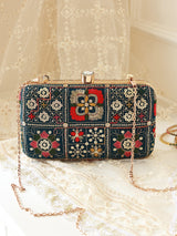 Elora Green Box Clutch by The Tan Clan featuring a sleek rectangular design with a textured green finish.