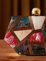 Emily multicolor mother of pearl clutch by The Tan Clan, showcasing a shimmering iridescent surface and elegant design.