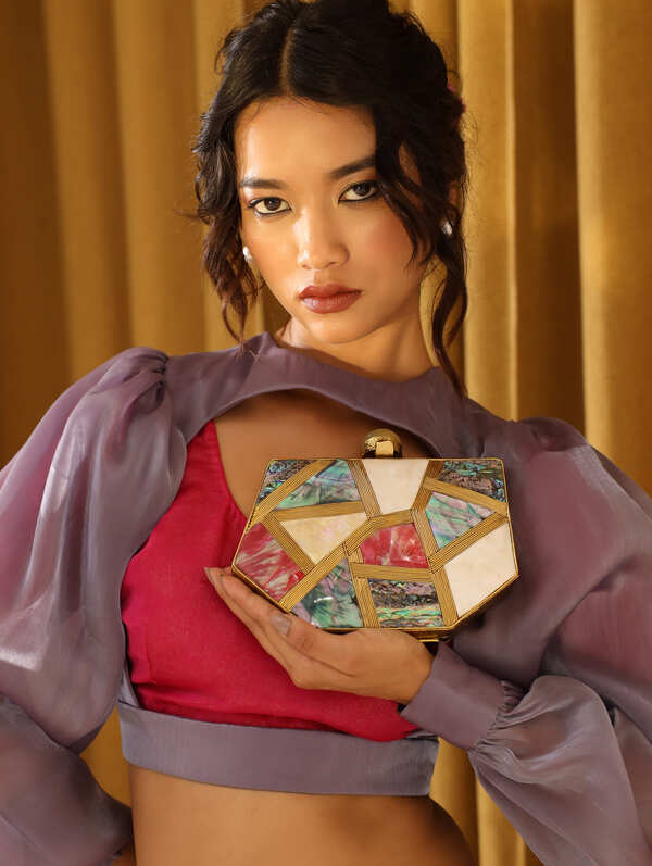 Multicolor Mother of Pearl Emily clutch by The Tan Clan with a sleek, elegant design and iridescent finish.