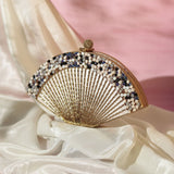 Faiza embellished mother of pearl clutch by The Tan Clan, featuring intricate design and elegant pearl accents.