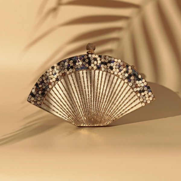 Elegant Faiza mother of pearl clutch with intricate embellishments by The Tan Clan, showcasing a luxurious evening bag design.