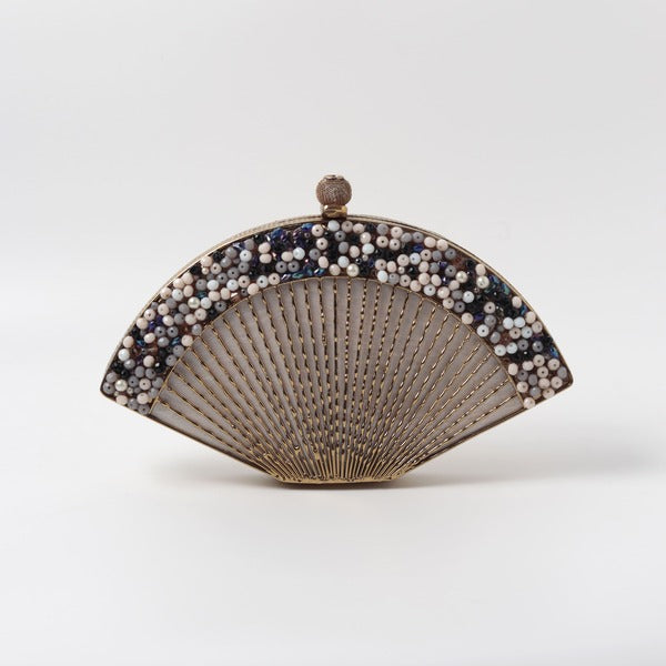Elegant Faiza embellished mother of pearl clutch by The Tan Clan with intricate beadwork and a sleek, compact design.