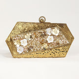 Gold brass clutch with intricate embellishments from The Tan Clan, featuring a stylish, compact design perfect for evening wear.