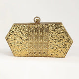 Gold brass clutch with intricate embellishments by The Tan Clan, featuring a sleek, elegant design perfect for special occasions.