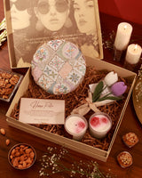 Elegant floral arrangement in a Mughal-themed hamper by The Tan Clan, featuring vibrant flowers and decorative accents.