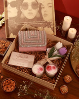 Pink floral-themed hamper with a decorative arrangement of flowers and gift items from The Tan Clan's Floral Grace Nysa Pink collection.