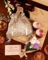 Floral Grace Hamper by The Tan Clan featuring a bouquet of mixed flowers in a decorative gift basket.