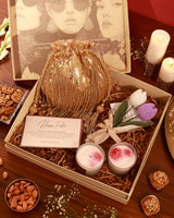 Floral Grace Hamper by The Tan Clan featuring a bouquet of colorful flowers arranged in an elegant wicker basket.
