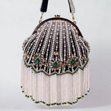 Black Frida Batua Bag with Detachable Handle by The Tan Clan, showcasing its stylish design and versatile carrying options.