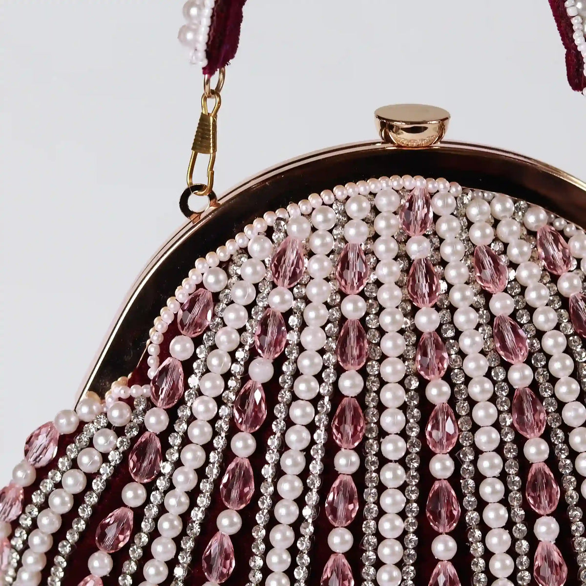 Maroon Frida Batua bag by The Tan Clan with a detachable handle, featuring a stylish design and compact size.