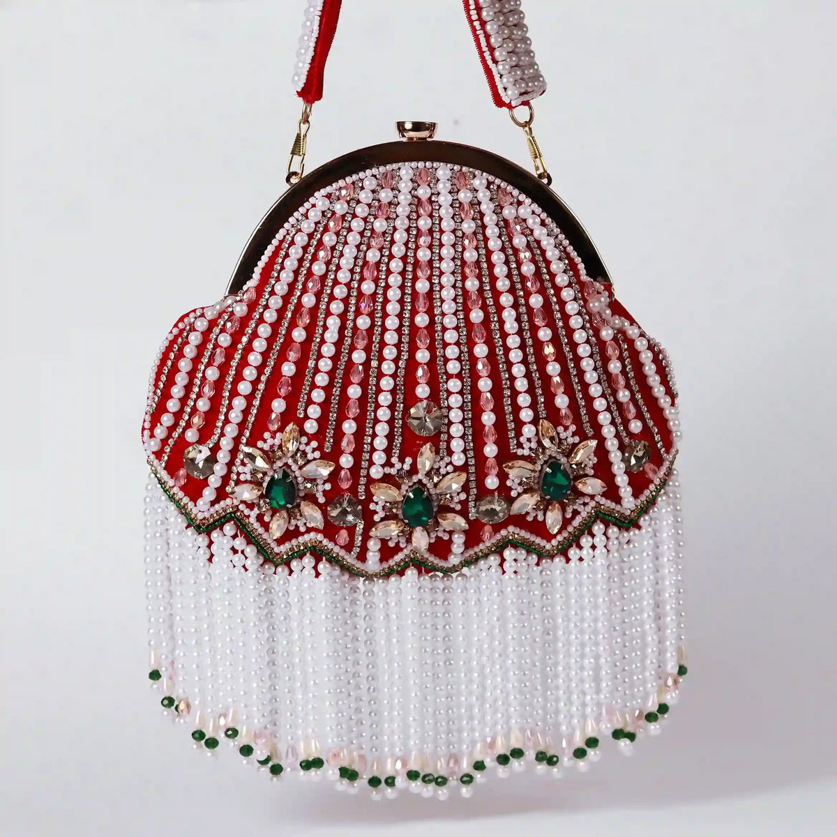 Red Frida Batua Bag by The Tan Clan featuring a detachable handle and stylish design, shown with the handle attached.