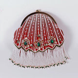 Red Frida Batua Bag by The Tan Clan with a detachable handle, showing the stylish bag with sleek design and vibrant color.